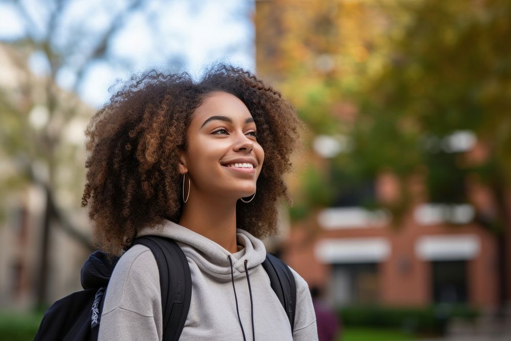 African american college student smile sky architecture. 