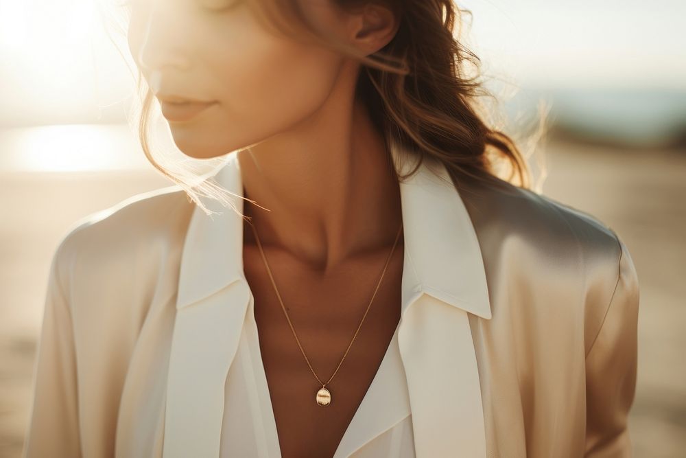Gold minimal jewelry necklace sunlight adult. AI generated Image by rawpixel.