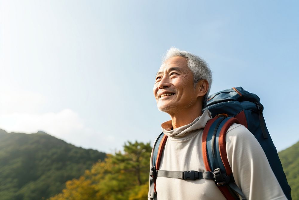Senior man hiking backpack smile sky. AI generated Image by rawpixel.