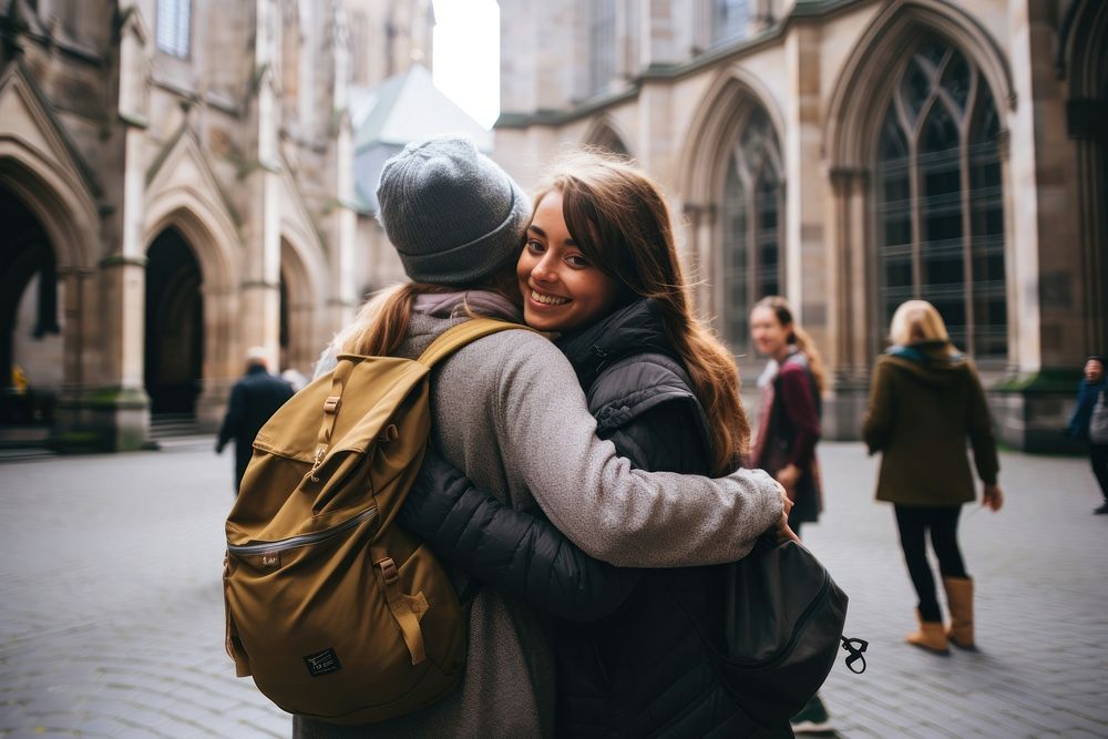Diverse students study abroad hugging adult togetherness. AI generated Image by rawpixel.