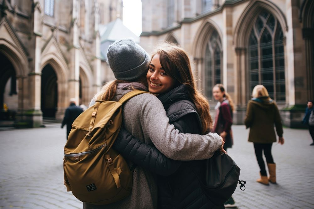 Diverse students study abroad hugging adult togetherness. 