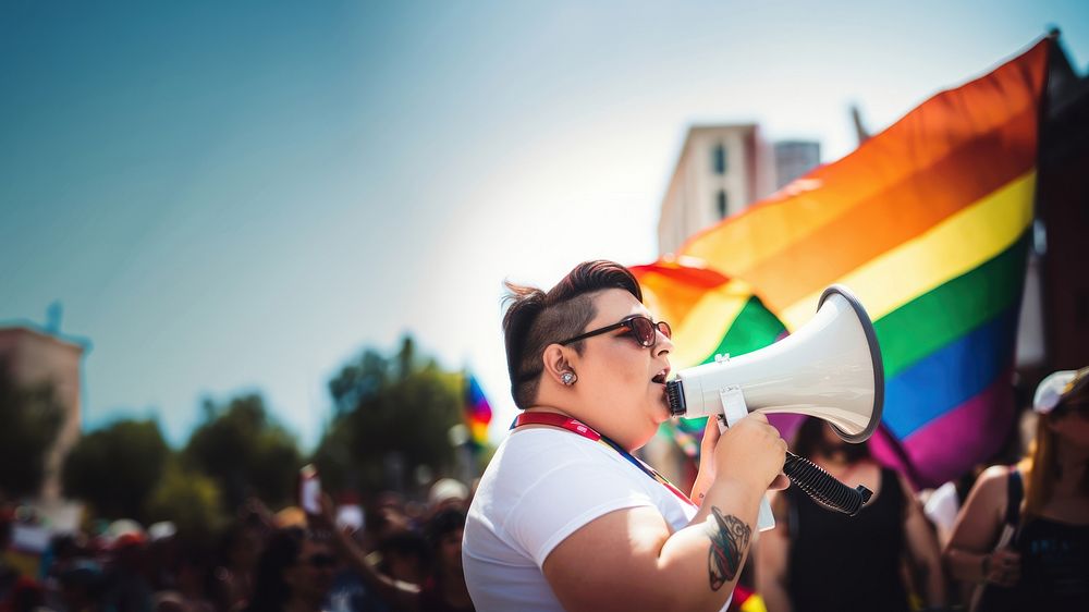 photo of plus size mexican lesbian woman using a megaphone at a pride parade. AI generated Image by rawpixel. 