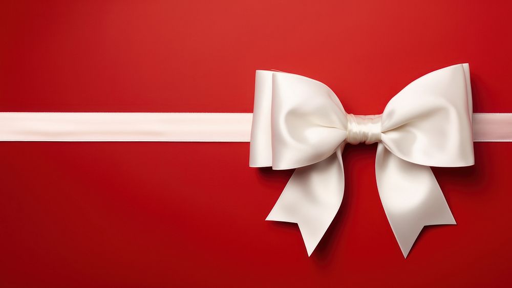 close up photo of a big white bow on gift box. 