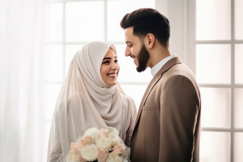 Cropped shot of muslim couple newlywed looking at each other, happy. AI generated Image by rawpixel.