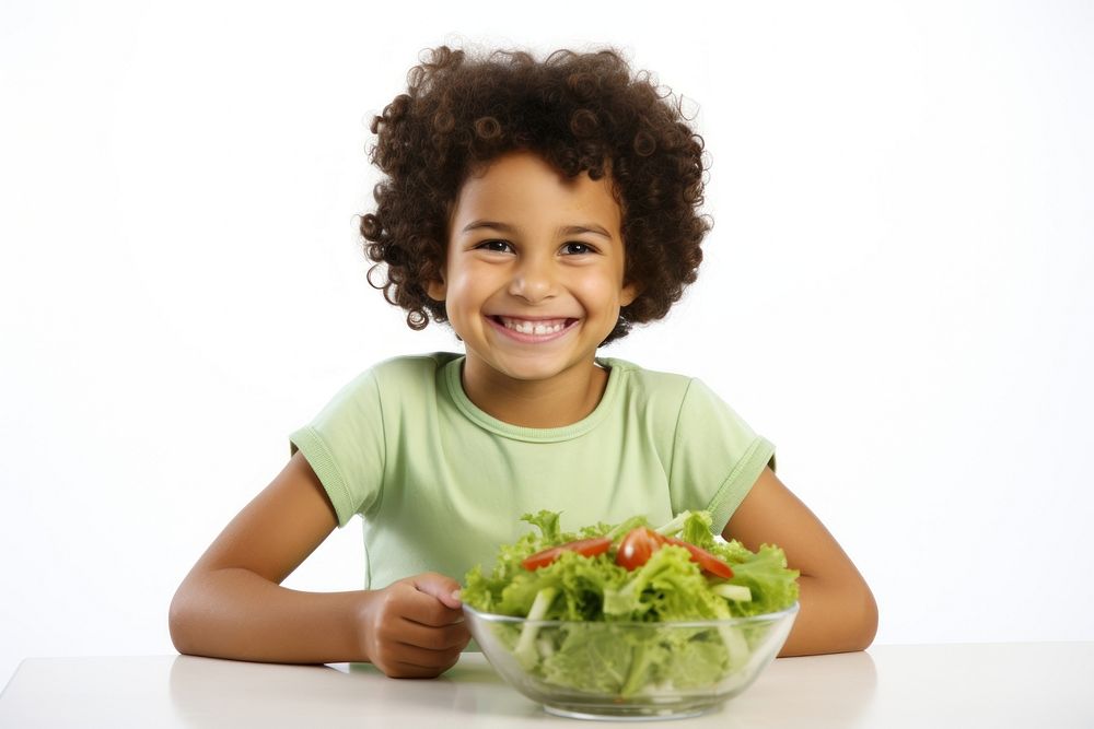 Kid eating salad child food bowl. AI generated Image by rawpixel.