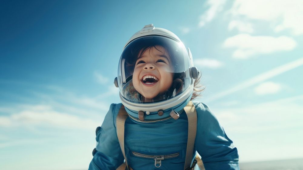 photo of smiling girl child dressed as astronaut.  