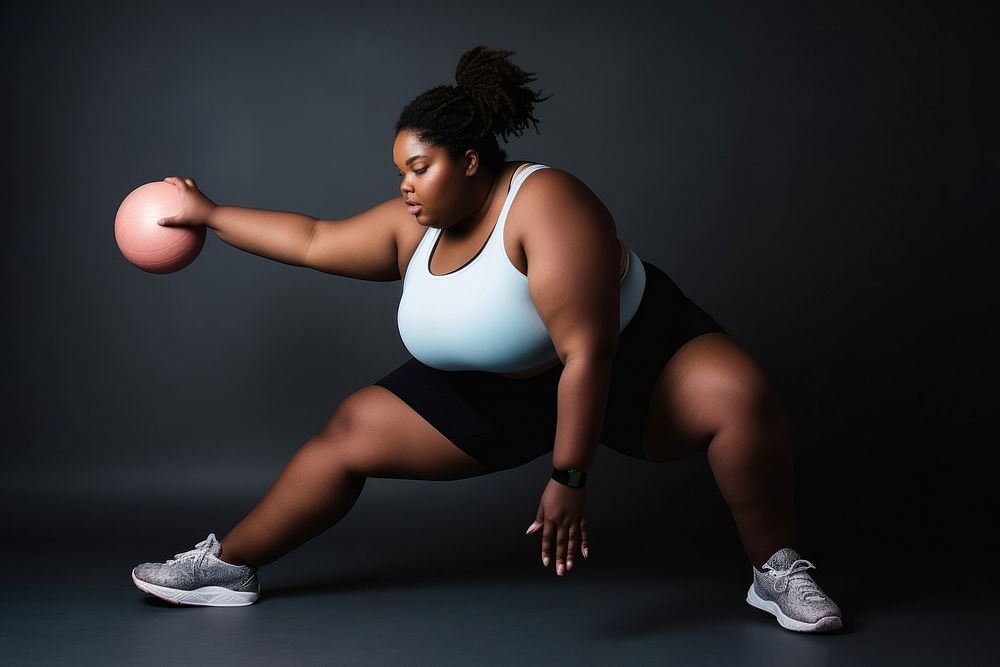 Photo of plus size woman doing fitness.  