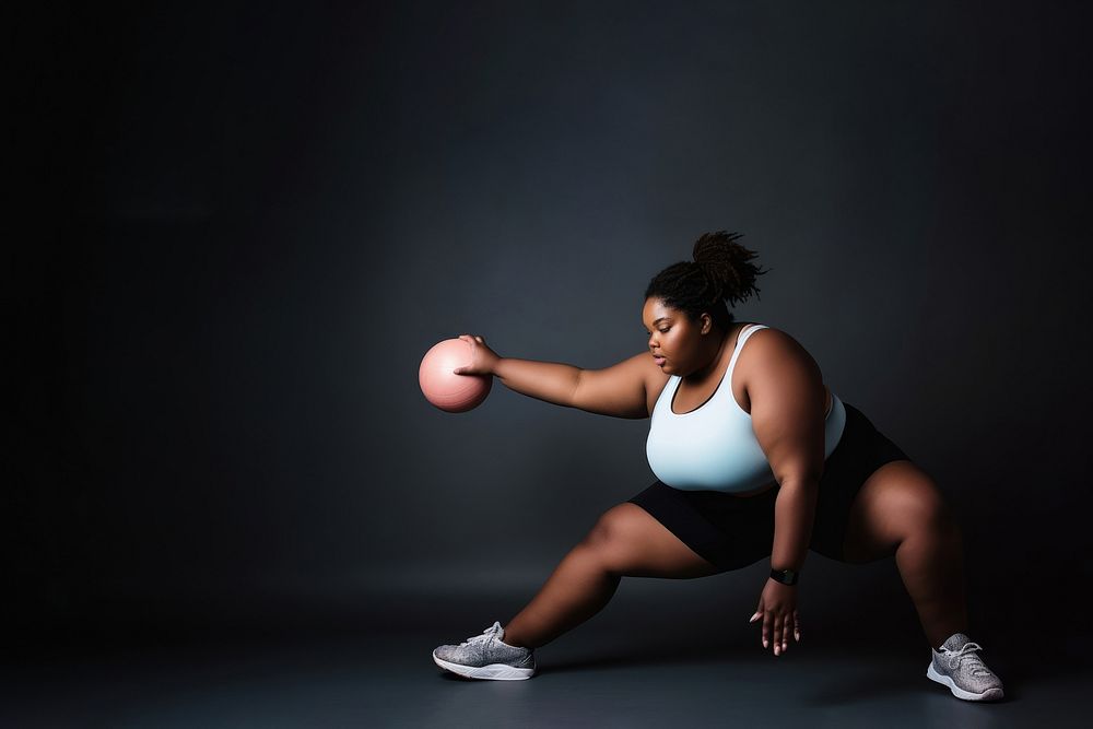 photo of plus size woman doing fitness.  