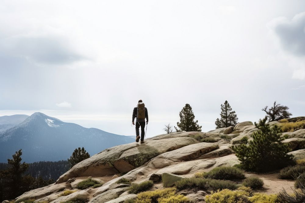 Photo of a hiking man, clear sky. AI generated image by rawpixel.