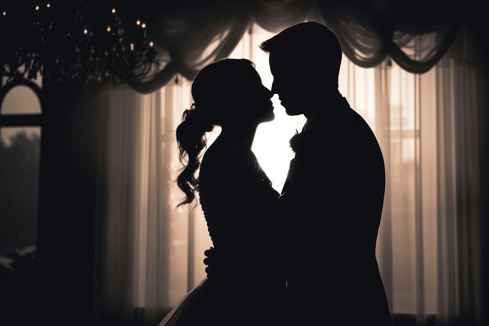 Wedding silhouette kissing bride. 