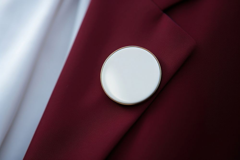Pin badge maroon photo photography. AI generated Image by rawpixel.