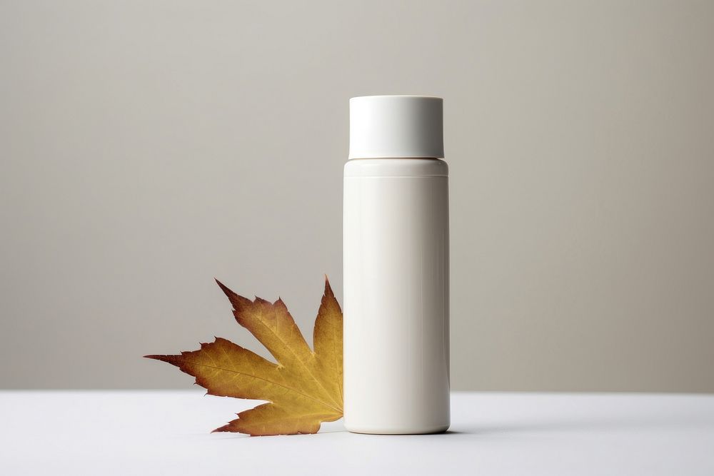 Cosmetic bottle leaf container drinkware. AI generated Image by rawpixel.