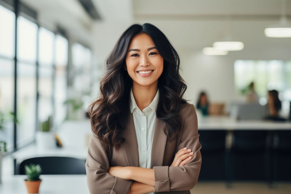 Happy asian woman smiling standing portrait office. 