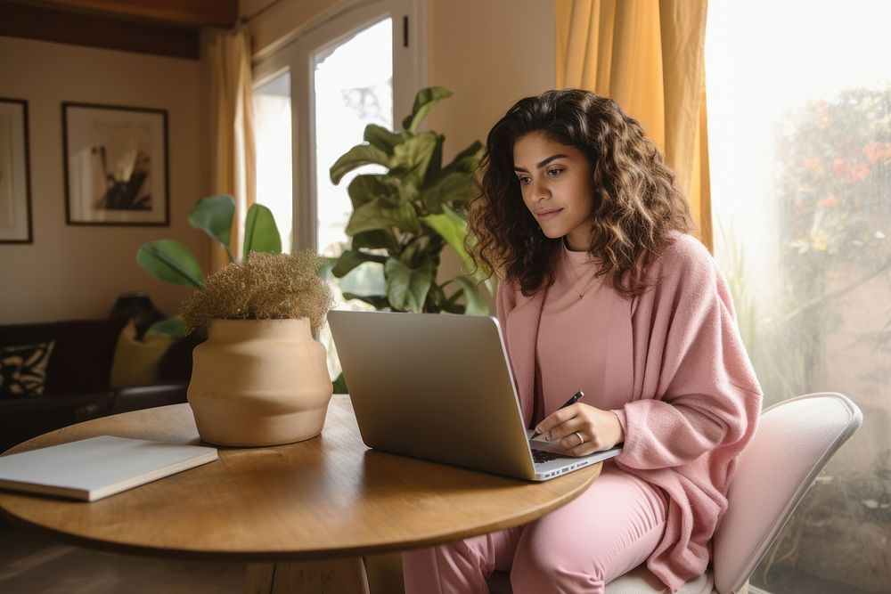 Young latina woman computer laptop furniture. AI generated Image by rawpixel.
