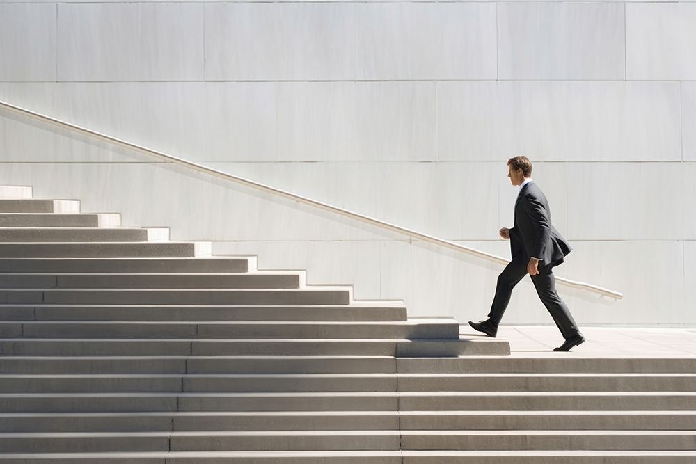 Businessman running architecture staircase footwear. AI generated Image by rawpixel.