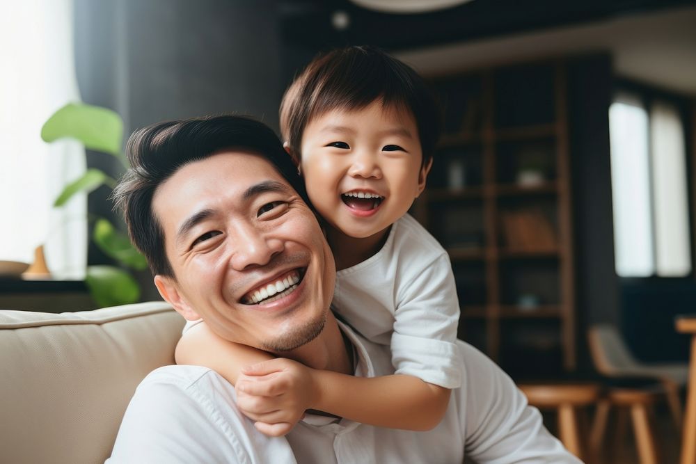 Son hugging happy father cheerful laughing toddler. AI generated Image by rawpixel.