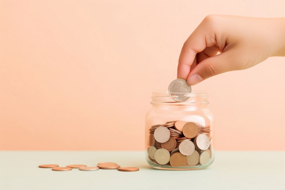 Hand dropping coin jar money pink background. AI generated Image by rawpixel.