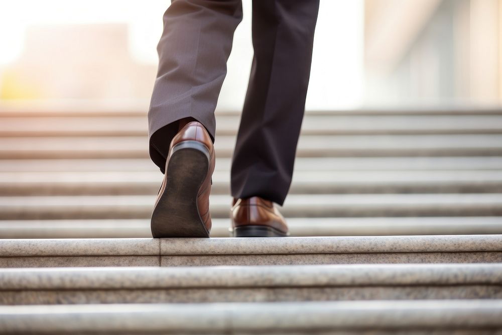 Businessman walking footwear outdoors stairs. AI generated Image by rawpixel.