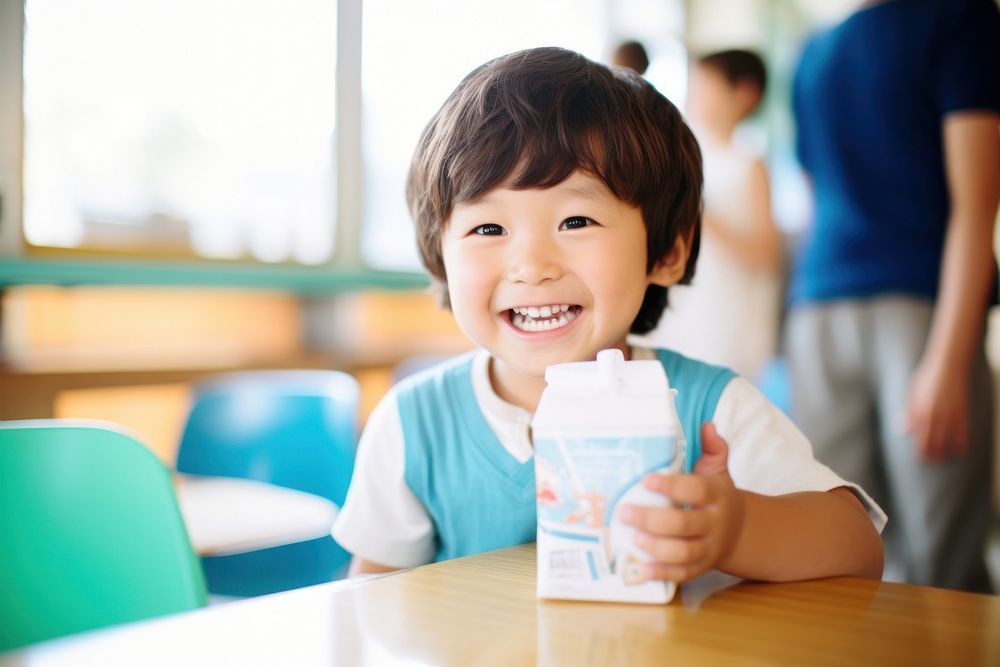 Kid drinking milk carton classroom child food. AI generated Image by rawpixel.
