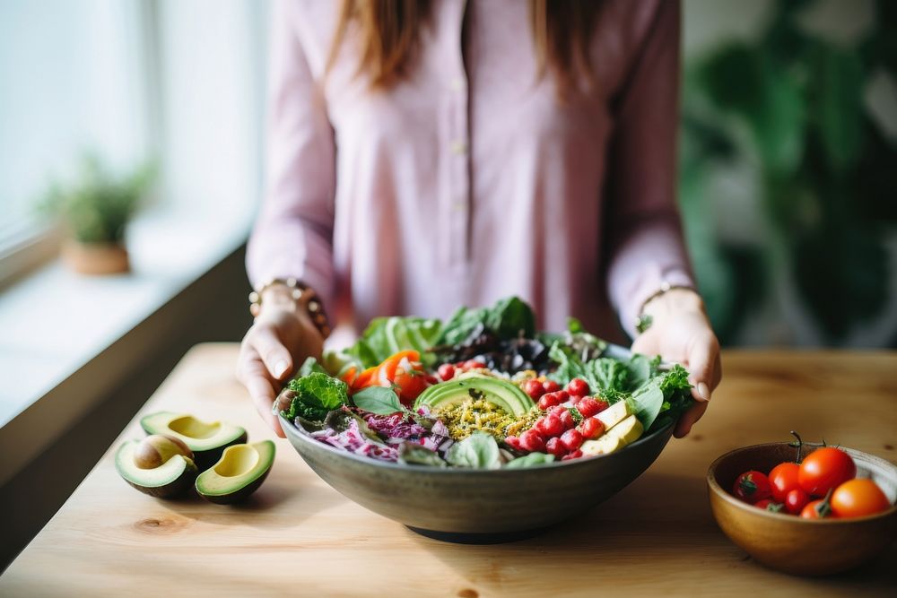 Female eating healthy vegan food table adult bowl. AI generated Image by rawpixel.