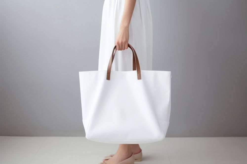 Women wearing white tote bag handbag accessories accessory. AI generated Image by rawpixel.