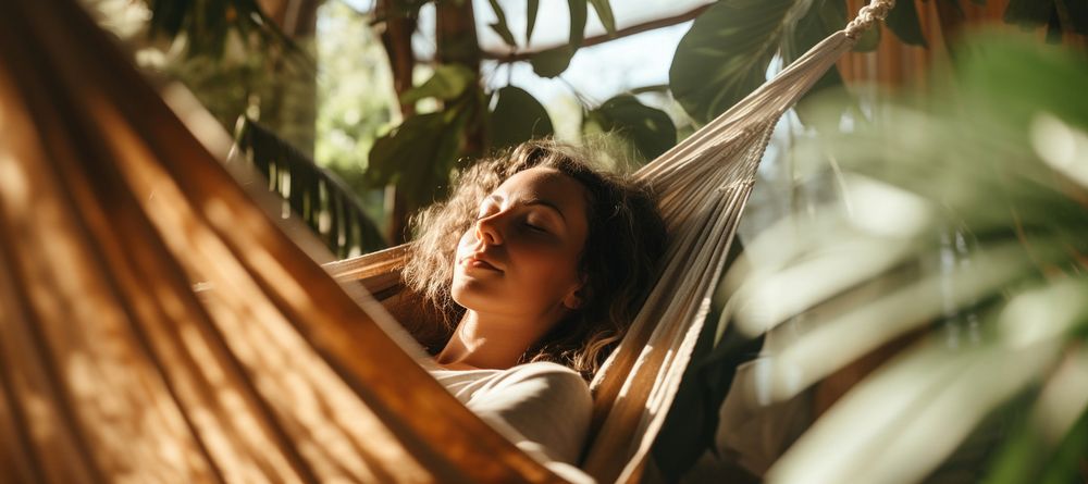 Woman napping on hammock. AI generated Image by rawpixel.