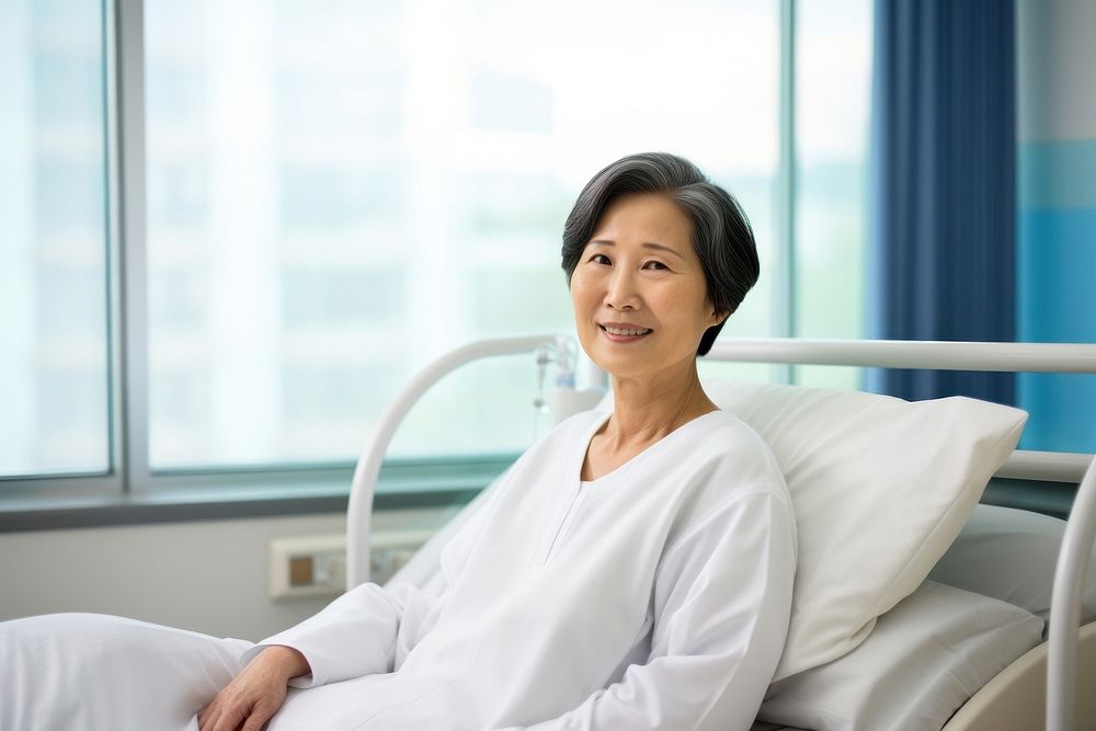 Mature woman patient in hospital gown. 