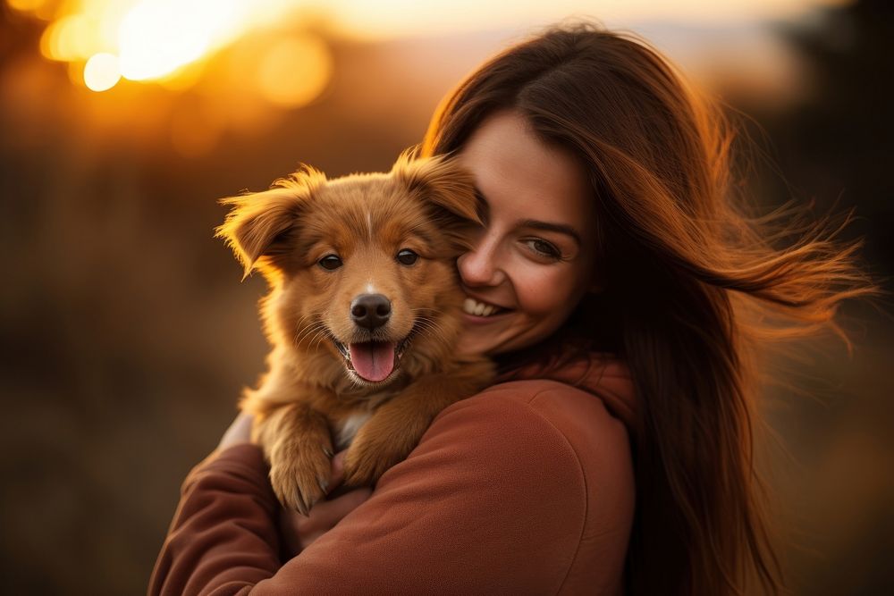 A woman holding a brown dog pitbull portrait outdoors mammal. AI generated Image by rawpixel.