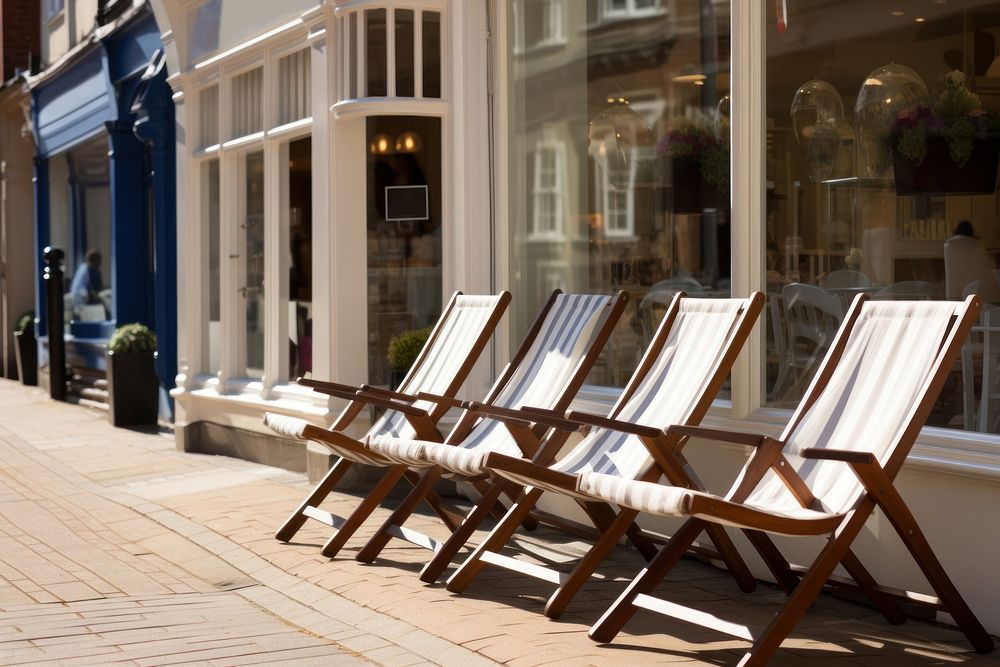 White deckchairs furniture outdoors city. 