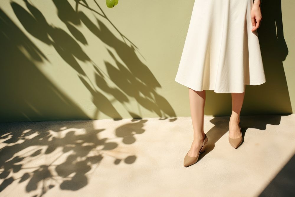 Skirt footwear fashion shadow. AI generated Image by rawpixel.