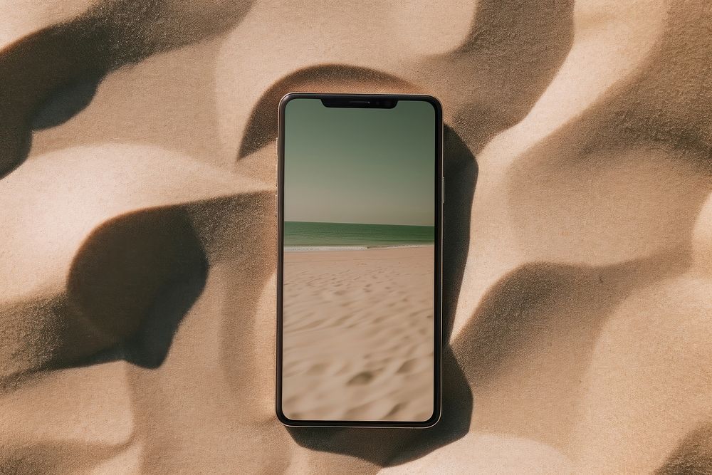Smartphone beach tranquility electronics. AI generated Image by rawpixel.