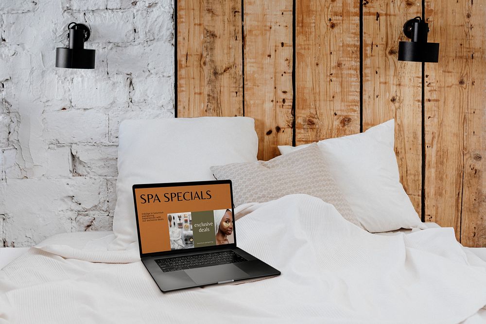 Laptop on a bed image