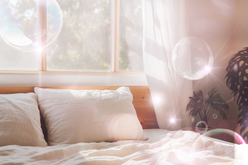 Bubbles floating in bedroom with morning light