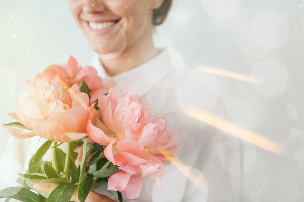 Woman holding flower bouquet  image with bokeh effect