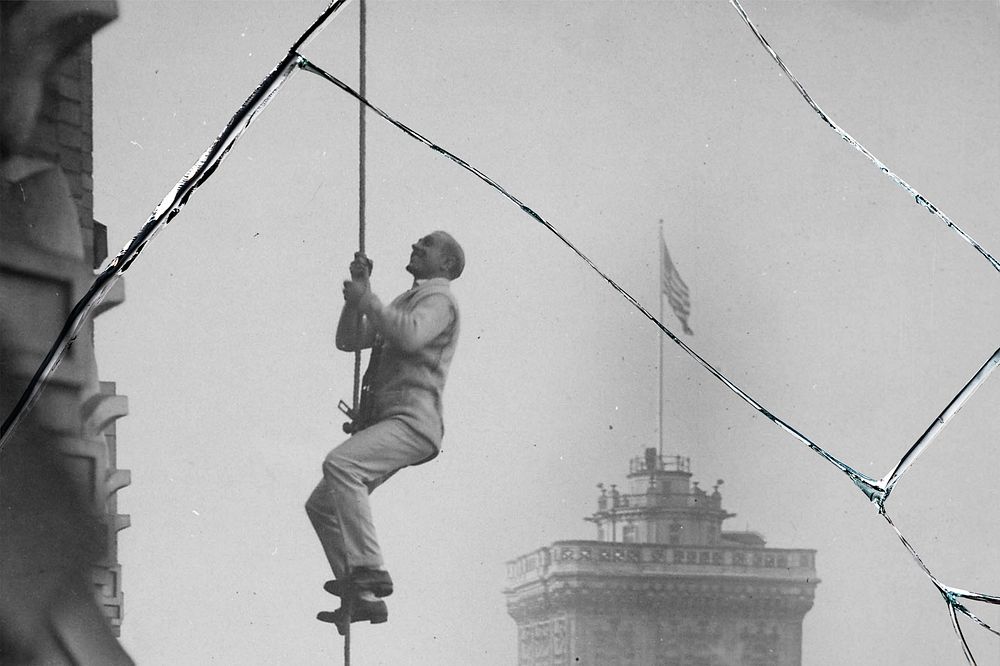 Man climbing rope with broken glass effect