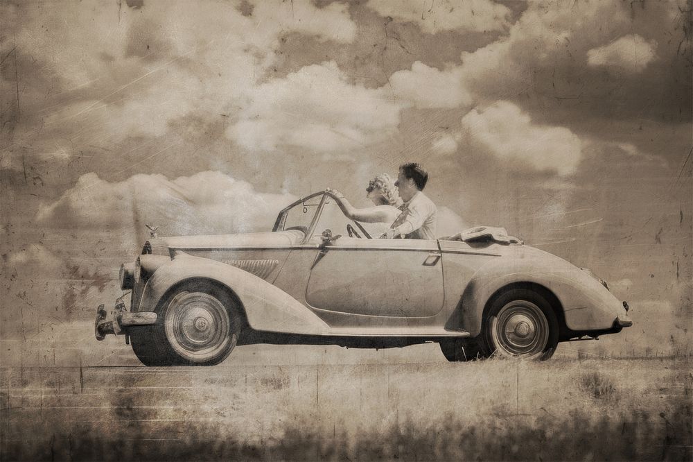 Couple driving with brown vintage effect