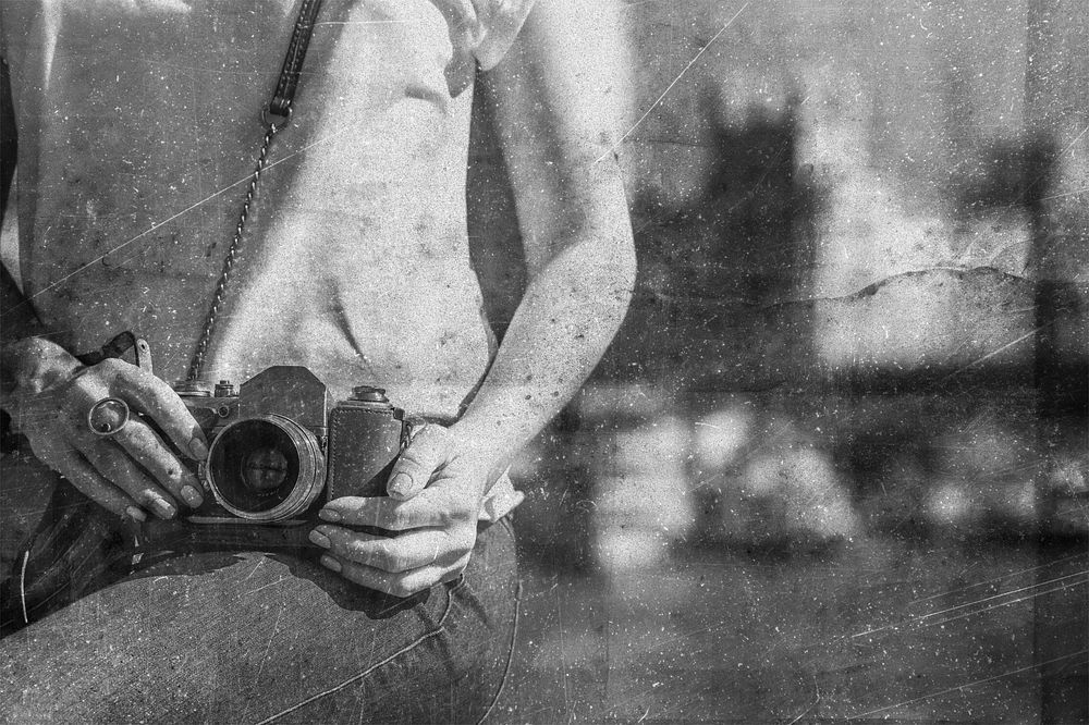 Woman photographer with black and white vintage effect