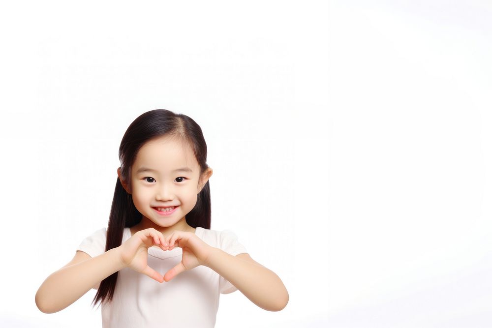 Asian girl with heart-shaped hands. AI generated Image by rawpixel.