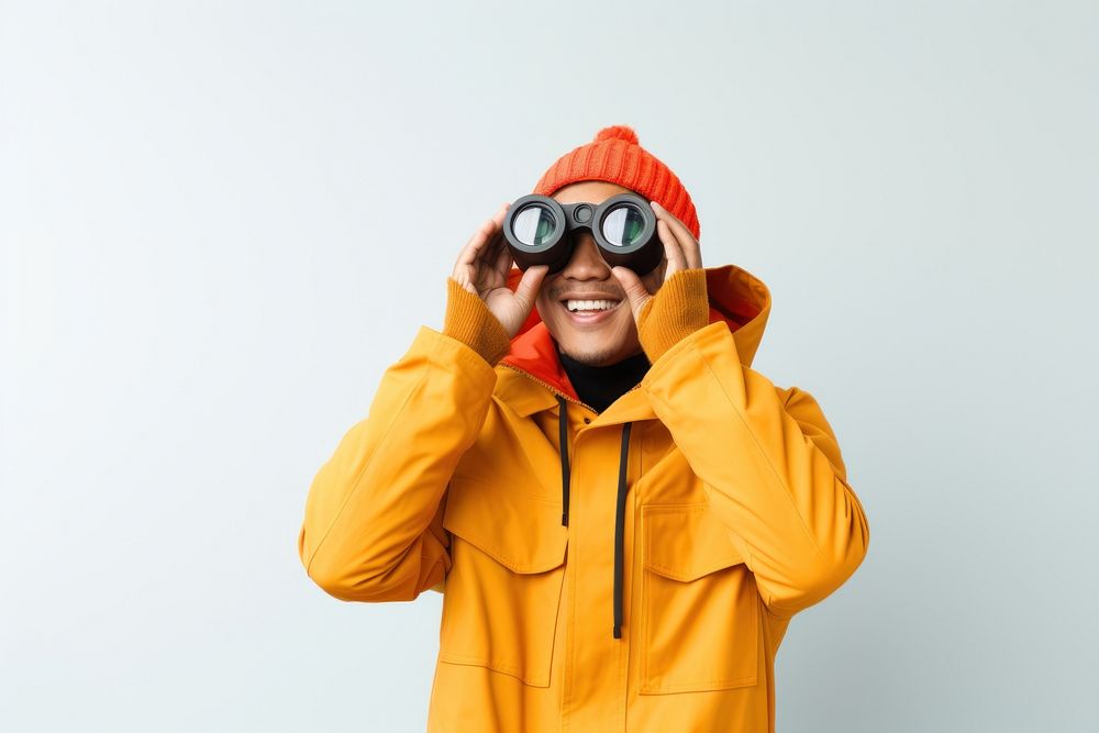 Asian man watching in binoculars photo mountaineering photography.