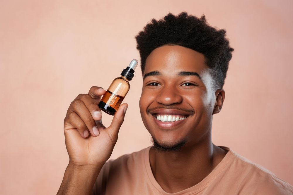 Smiling man cosmetics bottle face. AI generated Image by rawpixel.