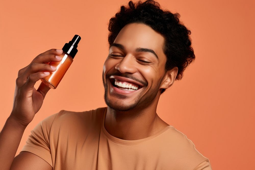 Smiling man cosmetics laughing bottle. AI generated Image by rawpixel.