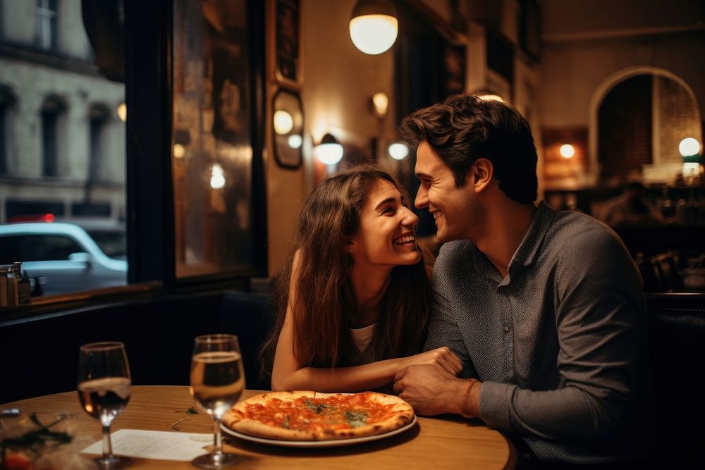 Pizza date restaurant portrait kissing. 