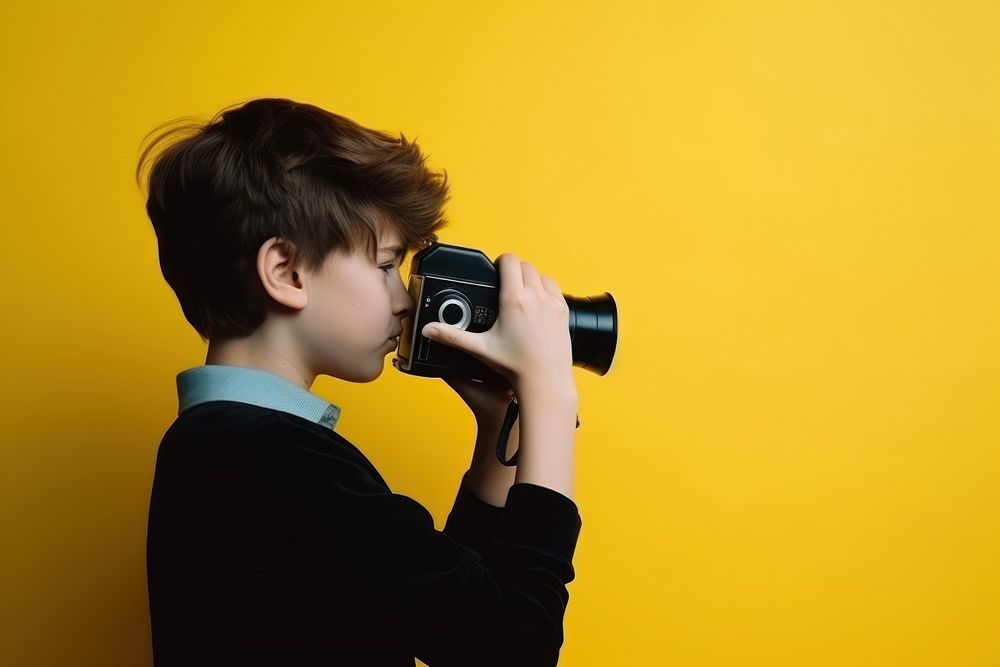 Young boy with film camera. AI generated Image by rawpixel.