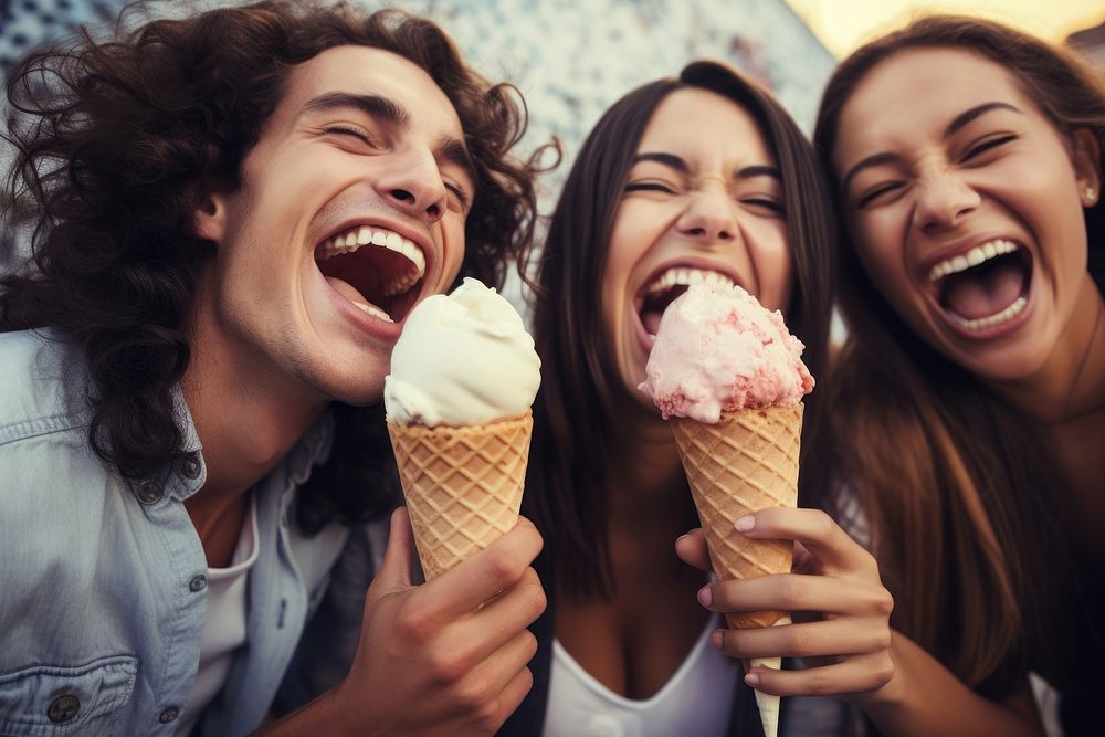 Eating ice cream laughing outdoors dessert. 