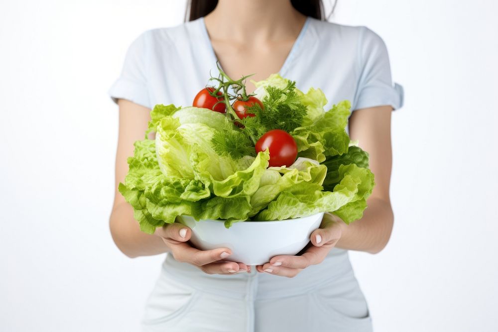 Young woman holding salad vegetable lettuce female. AI generated Image by rawpixel.