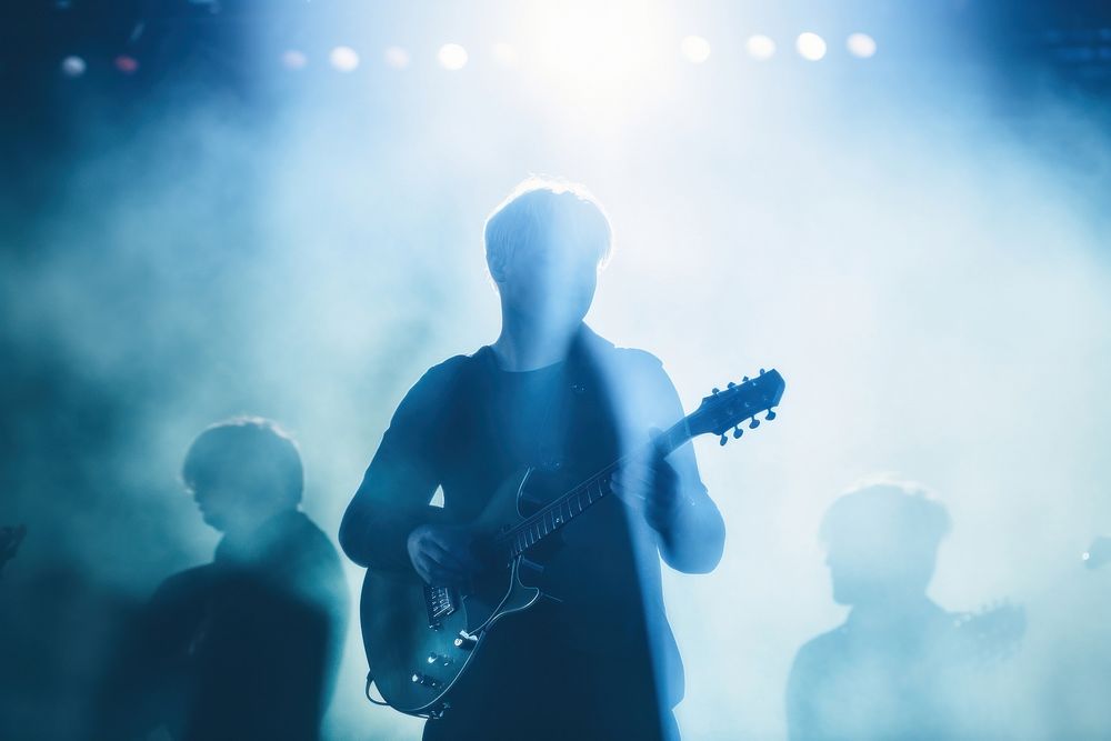 A man play guitar inthe concert musician adult entertainment. AI generated Image by rawpixel.