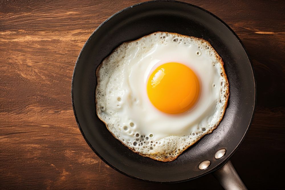 Fried egg food pan frying pan. AI generated Image by rawpixel.