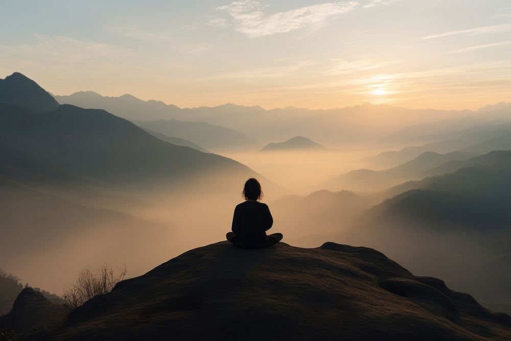 Mountain meditating outdoors sitting. AI generated Image by rawpixel.