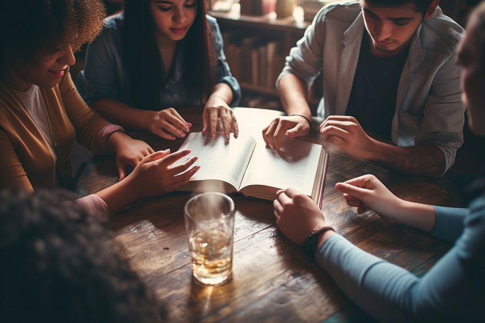 Friends discussing a book adult hand togetherness. AI generated Image by rawpixel.