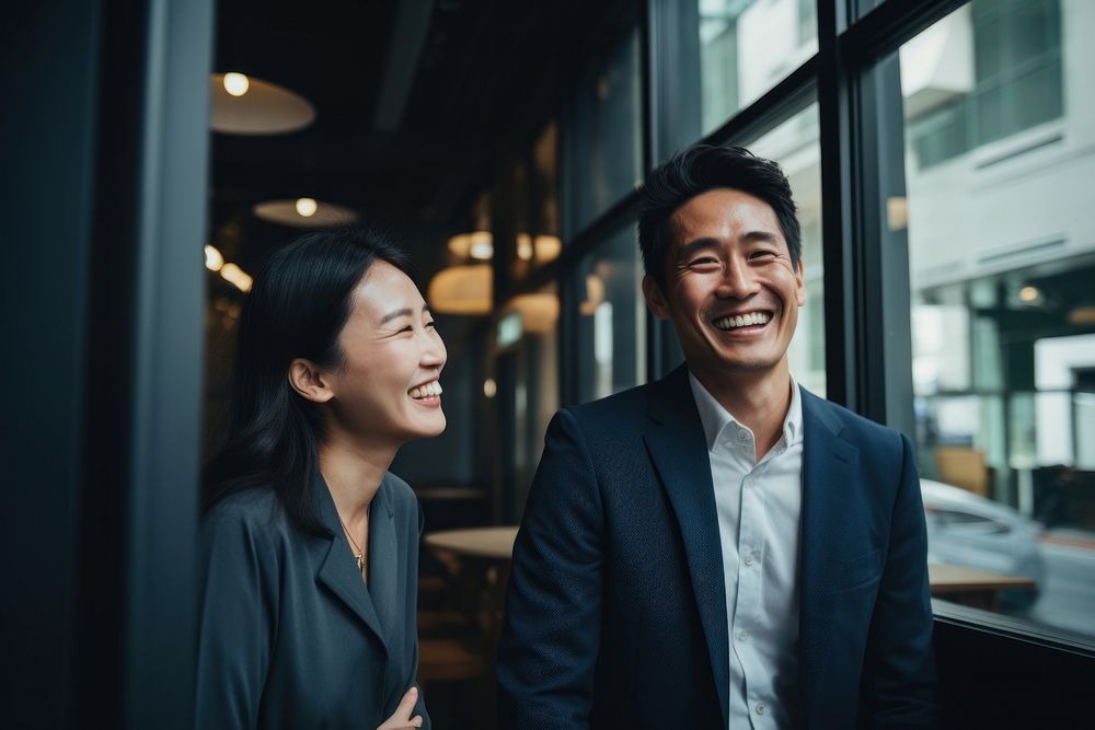 South east asian business people laughing adult human. AI generated Image by rawpixel.